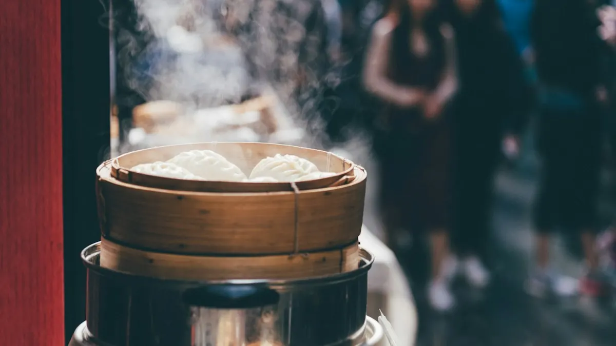 Stacked bamboo steamers of buns giving off steam at an outdoor food stall